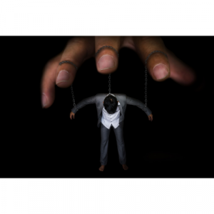 A puppet masters hand with strings coming from the fingers, holding a person up