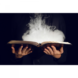 A picture of an open book with smoke coming from it